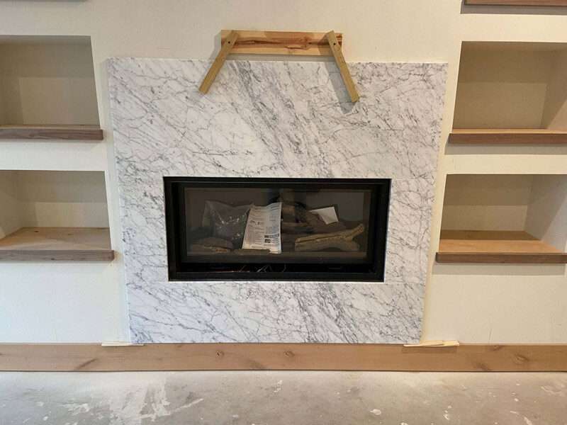 white carrera marble fireplace surround